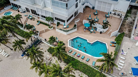Aerial view of a hotel with swimming pool and beach access