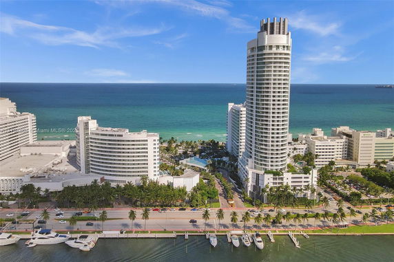 Aerial view of a high-rise building near the oceanfront.
