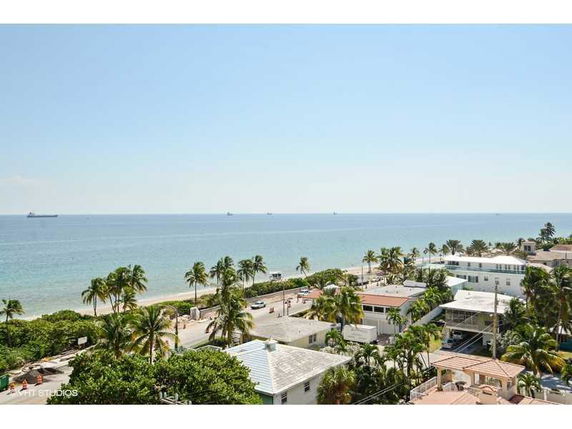Panoramic view of buildings near the coastline with the ocean in the background.