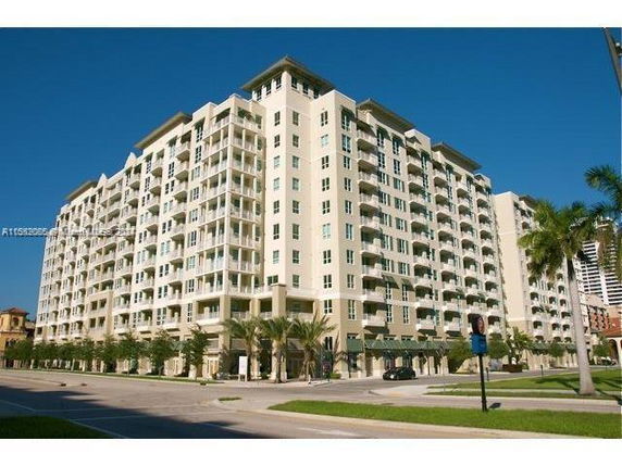 Front view of a large multi-story apartment building.