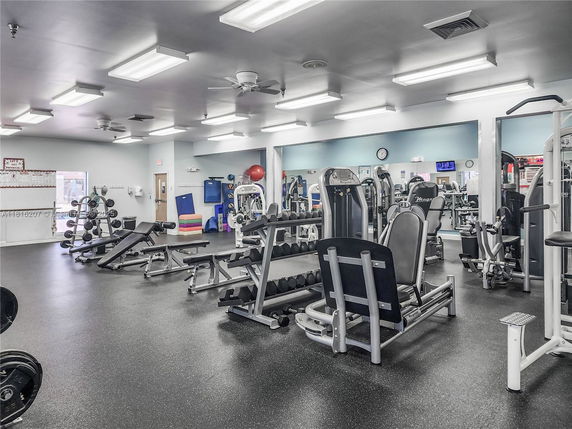 Interior view of a gym area with various exercise equipment.