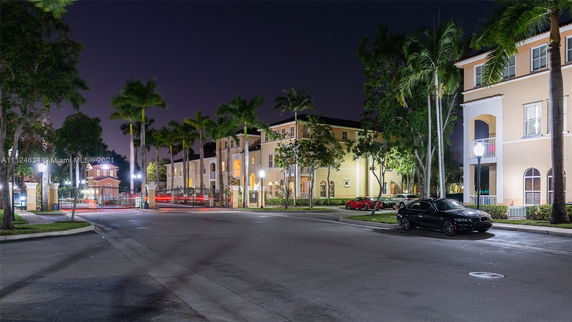 View of a multi-story residential building at night.
