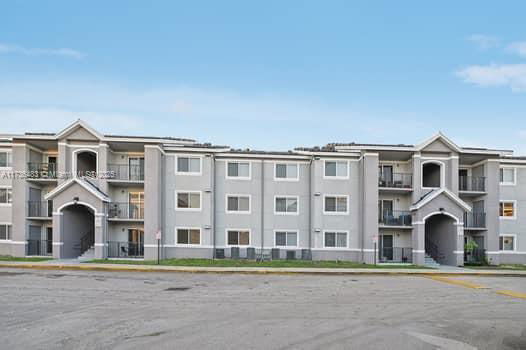 Front view of a multi-story apartment building.