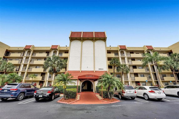 Front view of a multi-story residential building with balconies and labeled Building 6.