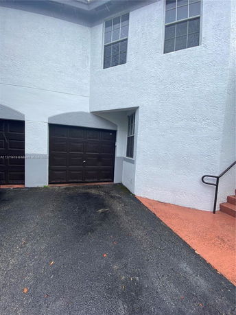 Front view of a house with a garage.