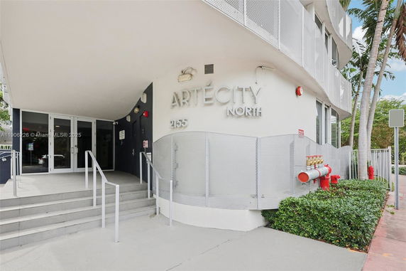 Front view of a building with entrance stairs and large signage reading 'Arté City North'.