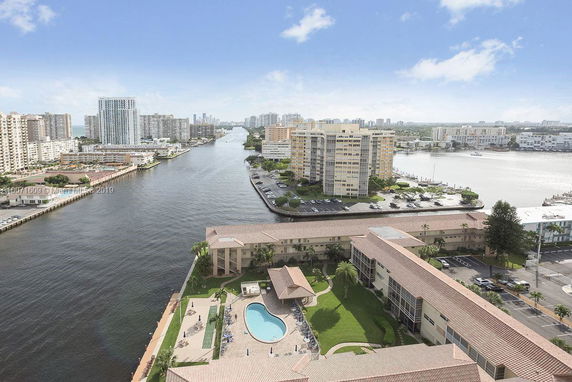 High-rise buildings along a canal with a view of surrounding waterfront area.