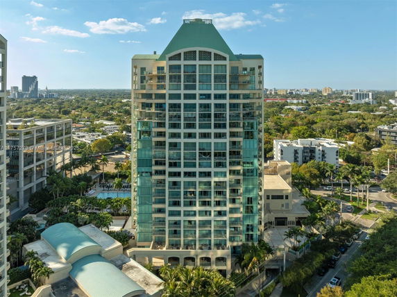Front view of a high-rise residential building with balconies.