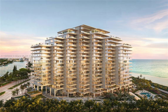 Front view of a modern multi-story building by the ocean.