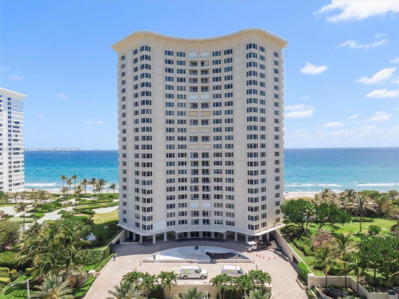 Tall residential building near the ocean.