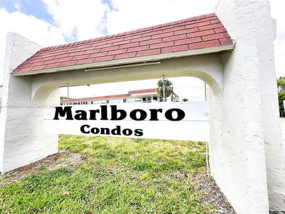 Front view of Marlboro Condos with sign and partial building visible.