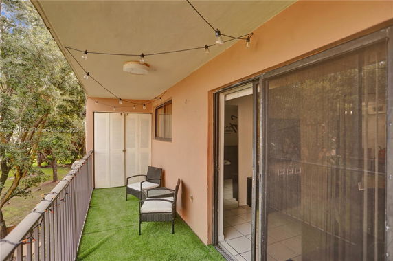 Balcony view with seating and string lights