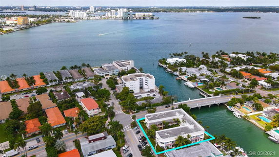 Wide-angle view of waterfront residential buildings and surrounding area