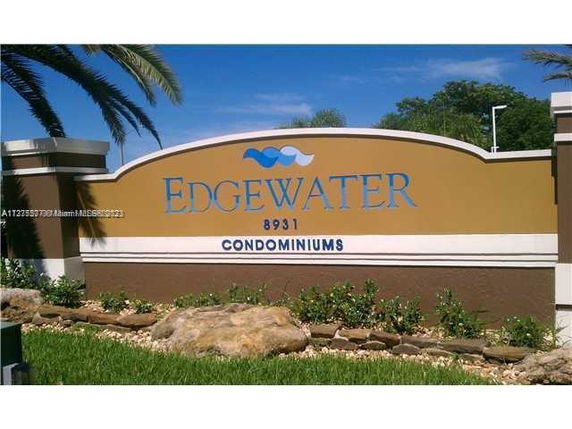 Front view of a sign for Edgewater Condominiums.