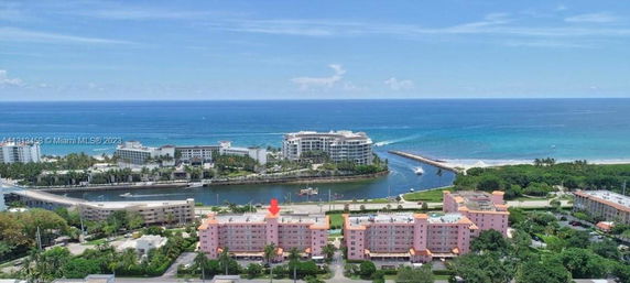 Panoramic view of pink residential buildings near the ocean.