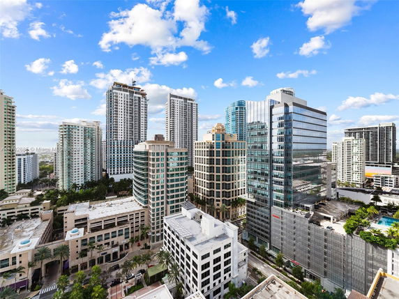 Aerial view of multiple high-rise buildings in an urban area.