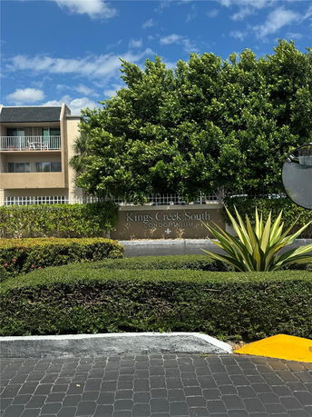 Front view of a multi-story condominium building.