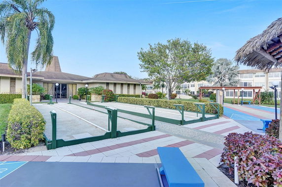 Outdoor recreational area with paved walkways and benches.
