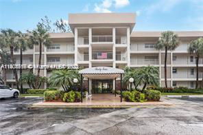 Front view of a multi-story building with balconies.