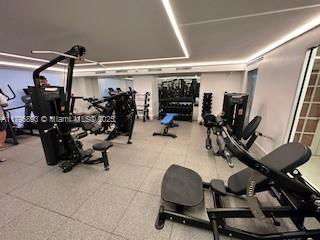 Indoor gym area with various exercise equipment.