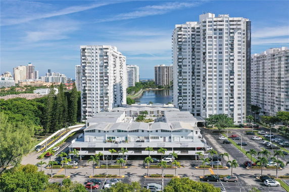 High-rise residential buildings with a view of waterfront and city skyline