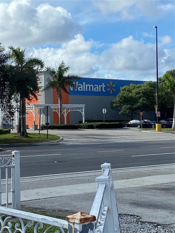 Front view of a large retail store with prominent signage.