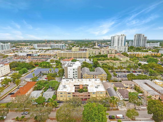 Panoramic view of cityscape with multiple buildings and roads.