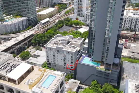 Aerial view of urban buildings with a surrounding cityscape.