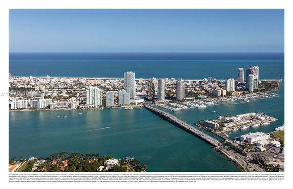 Panoramic view of a coastal cityscape with high-rise buildings, bridge, and harbor.