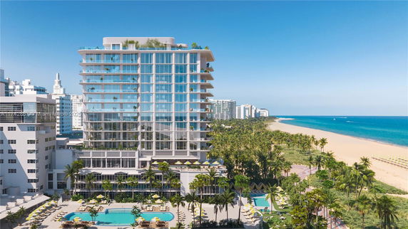 Front view of a modern multi-story beachfront building.