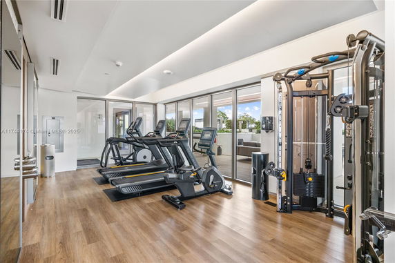 Gym area with treadmills and exercise machines.