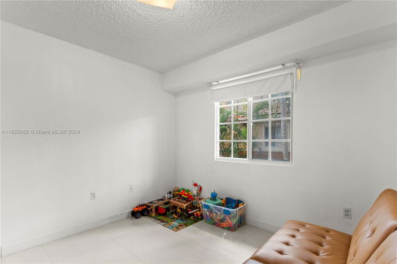 Small indoor play area with toys and a window.