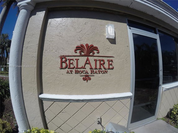 Front view of a building with signage reading 'Belaire at Boca Raton'.