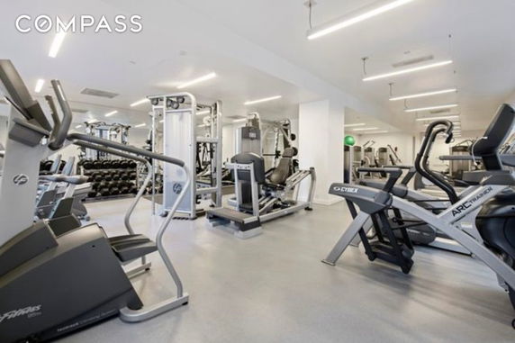 Indoor gym area with various exercise equipment.