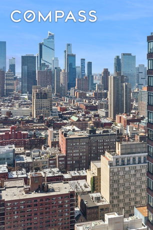 Panoramic view of a cityscape with high-rise buildings.