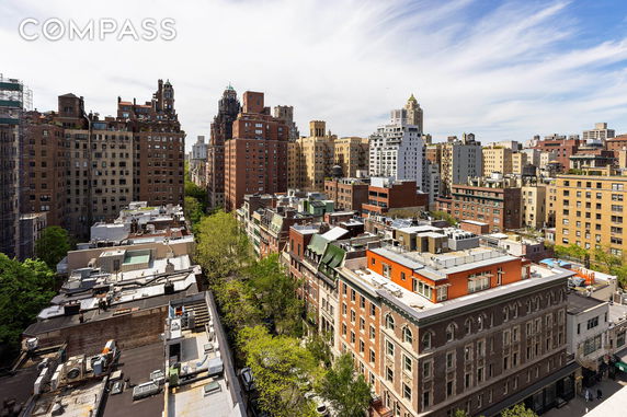 Panoramic view of multiple high-rise buildings in a cityscape.