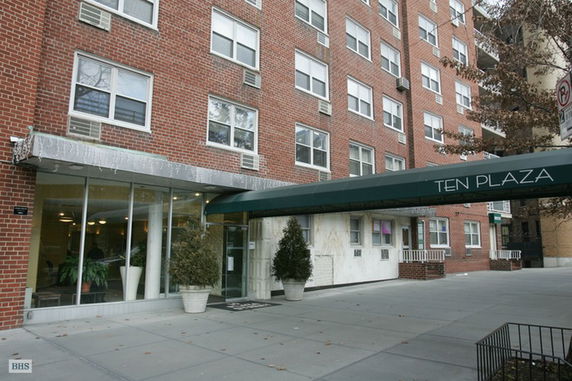 Front view of a multi-story brick building with a glass entrance and canopy labeled 'TEN PLAZA'.