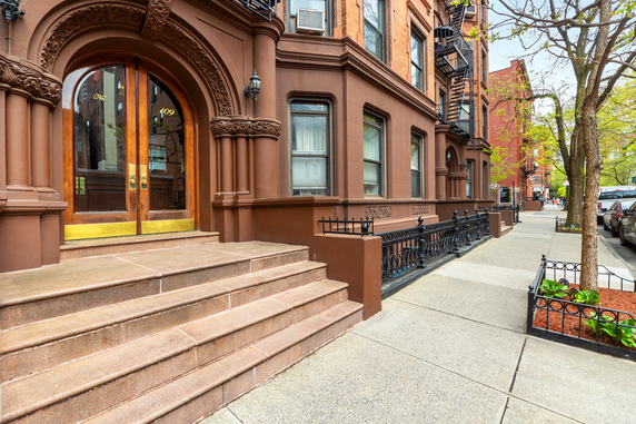 Front view of a historic building with detailed architectural features.