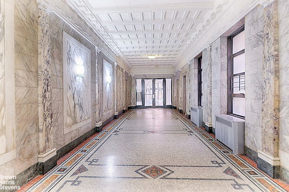 Front view of a house with multiple stories and a modern design.