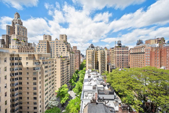 Panoramic view of tall city buildings with a clear sky.