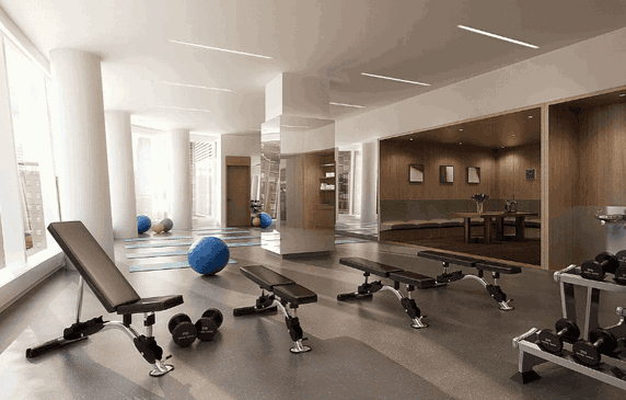 Indoor gym area with exercise benches, dumbbells, and yoga mats.