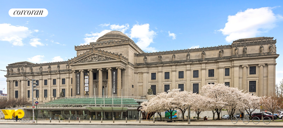 Front view of a grand, historic building with columns and ornate architectural details.