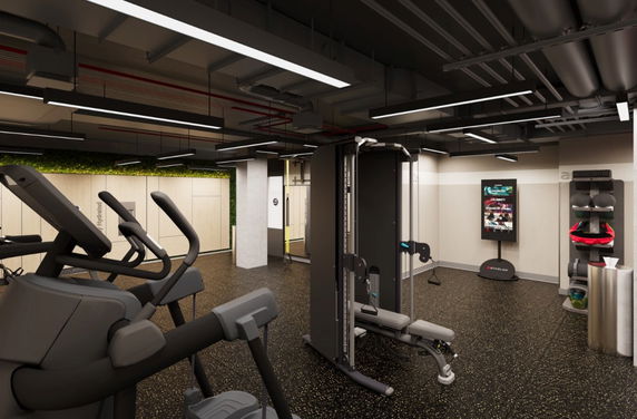 Indoor gym area with exercise equipment and modern lighting.