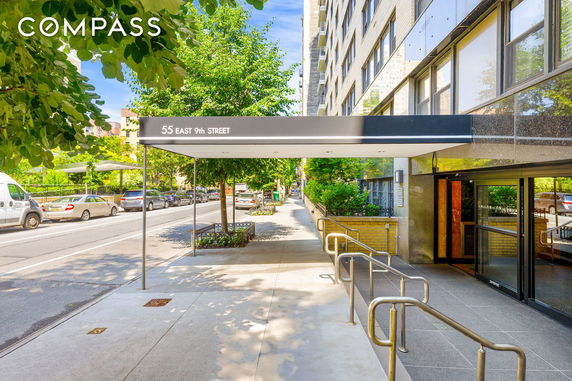 Front view of a building with an entrance and covering at 55 East 9th Street.