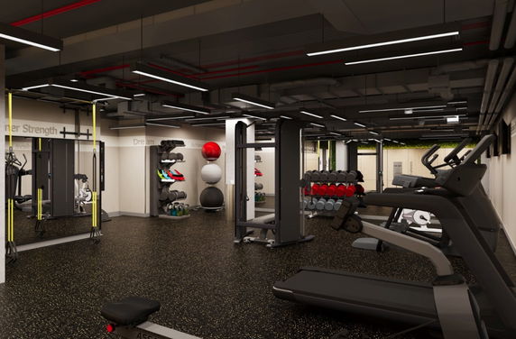 Interior view of a gym with exercise equipment and weights.