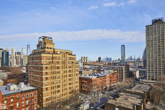 Cityscape featuring several buildings with the skyline in the background.