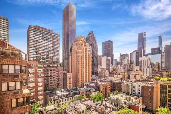 Panoramic view of a cityscape with multiple high-rise buildings.