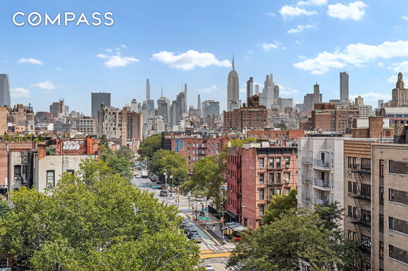 Panoramic view of a city skyline with various buildings.