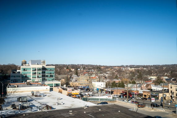 Wide-angle view of a town with residential and commercial buildings.