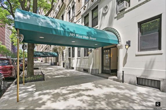 Street-level view of a building entrance with a green canopy labeled 305 West 86th Street.